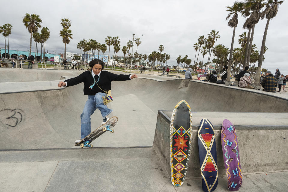 Expert skateboarder Di'Orr Greenwood, an artist born and raised in the Navajo Nation in Arizona and whose work is featured on the new U.S. stamps, exits the concrete bowl in the Venice Beach neighborhood in Los Angeles Monday, March 20, 2023. On Friday, March 24, the U.S. Postal Service is debuting the "Art of the Skateboard," four stamps that will be the first to pay tribute to skateboarding. The stamps underscore how prevalent skateboarding has become, especially in Indian Country, where the demand for designated skate spots has only grown in recently. (AP Photo/Damian Dovarganes)