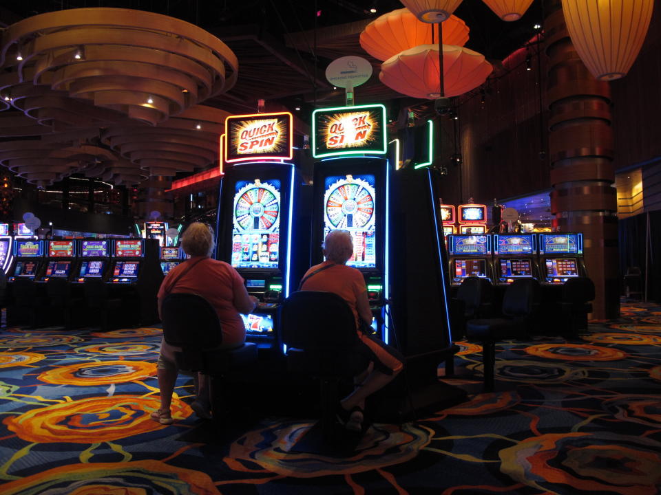 In this June 18, 2019 photo gamblers play slot machines at the Ocean Casino Resort in Atlantic City, N.J. Figures released by New Jersey gambling regulators on Friday, Nov. 22 show Atlantic City's nine casinos saw an increase in their gross operating profits of 12.5% in the third quarter of this year, to $239 million compared to the third quarter of 2018. (AP Photo/Wayne Parry)