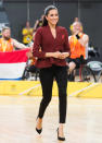 <p>For the 2018 Invictus Games wheelchair basketball finale, Meghan chose a £303 plum-hued jacket by Aussie label Scanlan Theodore and teamed the look with skinny jeans. [Photo: Getty] </p>