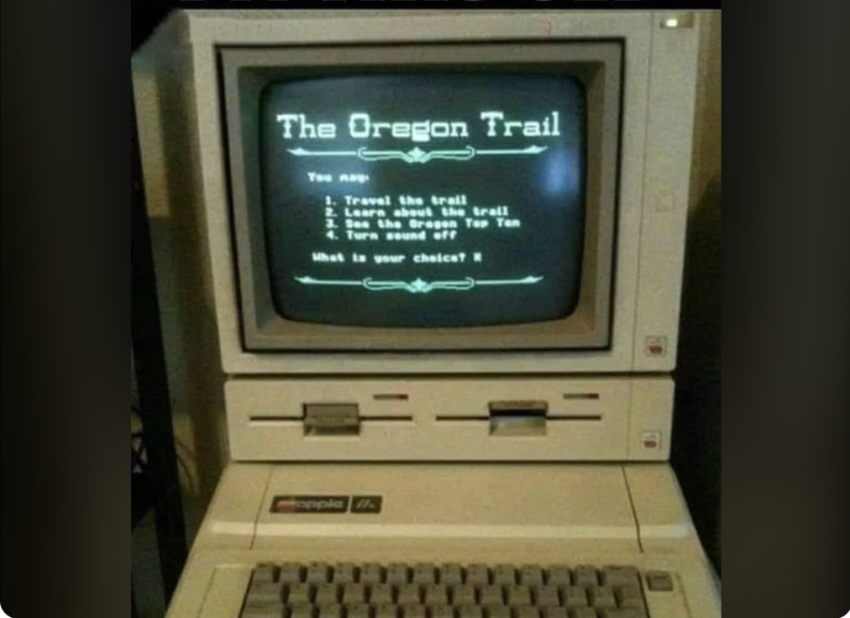 A computer running "The Oregon Trail" game