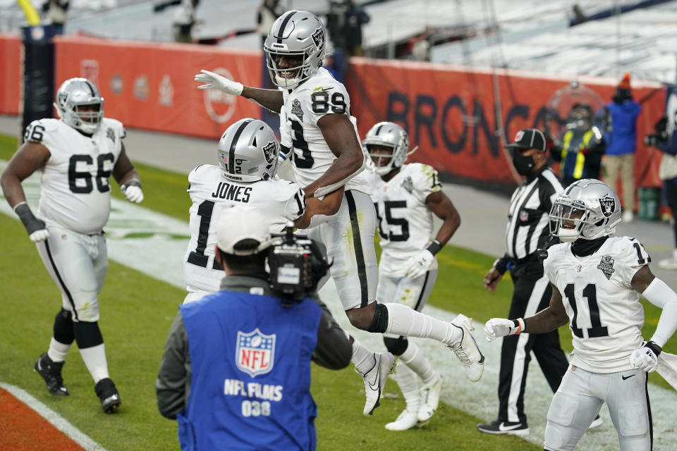 Las Vegas Raiders wide receiver Bryan Edwards (89) celebrates after scoring a touchdown against the Denver Broncos during the first half of an NFL football game, Sunday, Jan. 3, 2021, in Denver. (AP Photo/David Zalubowski)