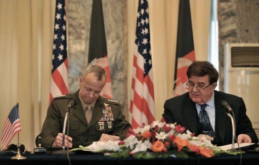 US commander in Afghanistan, General John Allen (L) and Afghanistan Defence Minister, Abdul Rahim Wardak sign an agreement during a ceremony at the foreign ministry in Kabul. Washington and Kabul signed a deal on special forces operations in the insurgency-wracked country, putting Afghans in charge of controversial night raids