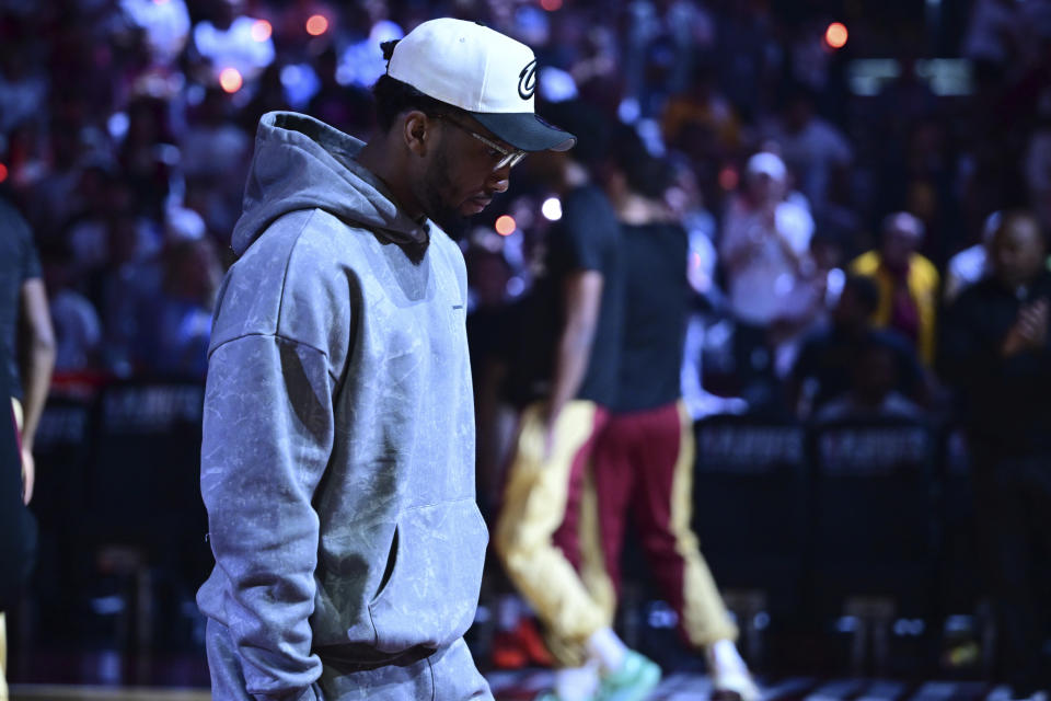 Cleveland Cavaliers guard Donovan Mitchell walks on the floor before the the first half of Game 4 of an NBA basketball second-round playoff series against the Boston Celtics Monday, May 13, 2024, in Cleveland. (AP Photo/David Dermer)