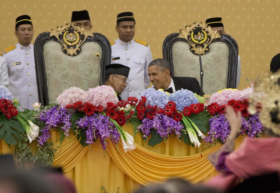 U.S. President Barack Obama talks with Malaysian King Abdul Halim Mu'adzam Shah during a state dinner at the King's Palace or Istana Negara in, Kuala Lumpur, Malaysia, Saturday, April 26, 2014. The last U.S. president to visit Malaysia was Lyndon B. Johnson in 1966. (AP Photo/Carolyn Kaster)