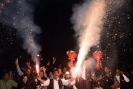 <p>Congress workers celebrate outside Rahul Gandhi residence after his last leg of Gujarat Campaign and his elevation to Congress president on December 12, 2017 in New Delhi, India. (Photo by Vipin Kumar/Hindustan Times via Getty Images) </p>