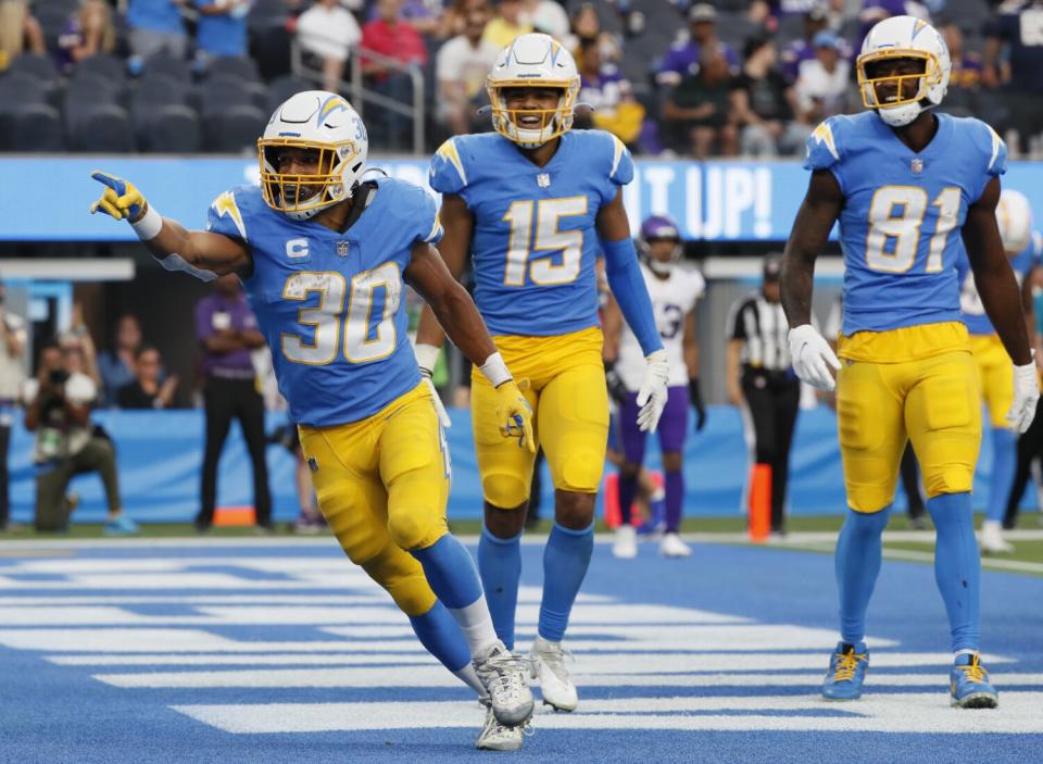 Chargers running back Austin Ekeler looks to celebrate after scoring a touchdown.