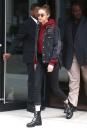 <p>In a blood red hoodie, distressed denim jacket, cropped black jeans, studded ankle combat boots and round sunglasses while out in New York City.</p>