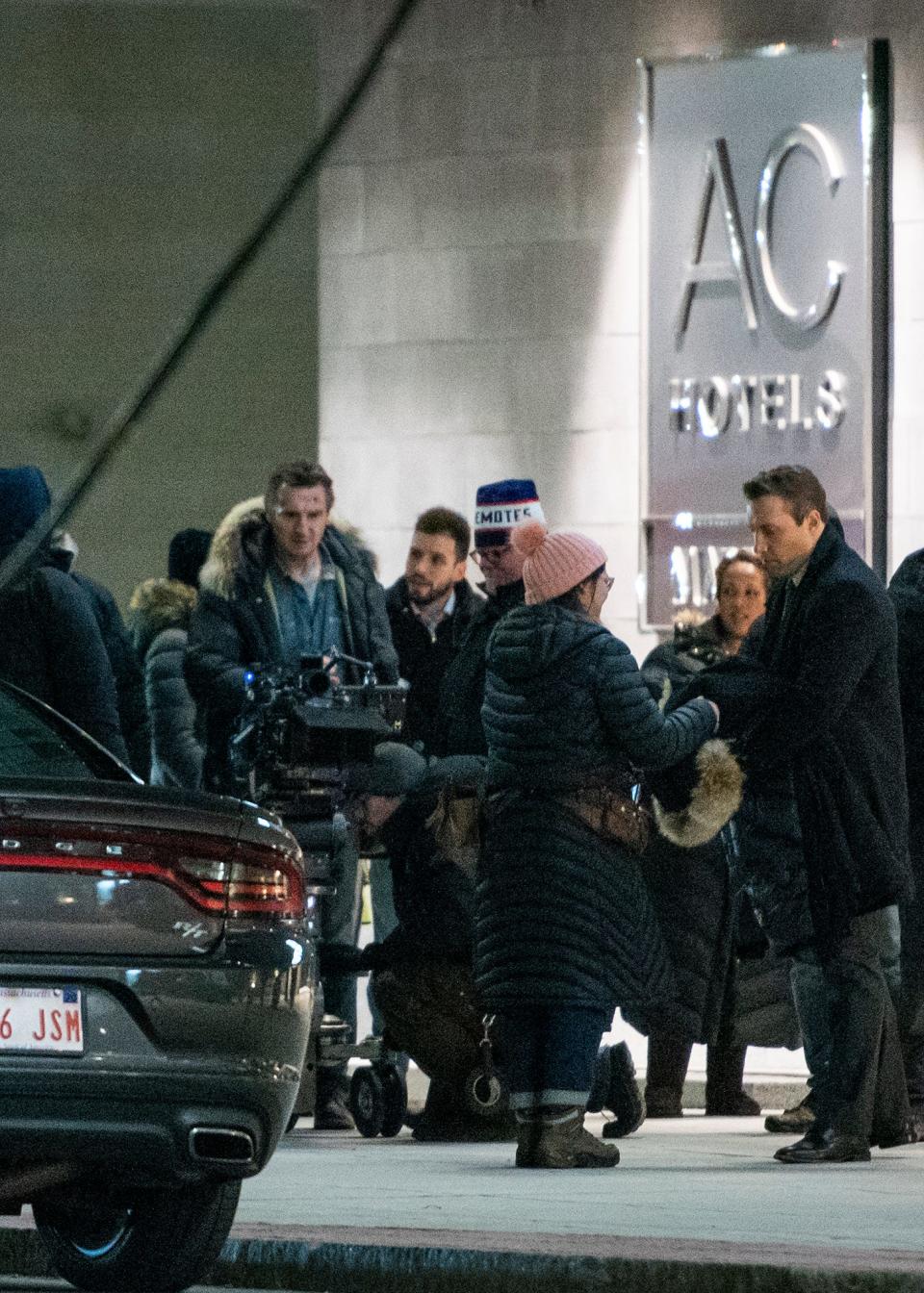 Actor Liam Neeson, right, films ''Honest Thief'' outside the AC Marriott in downtown Worcester.