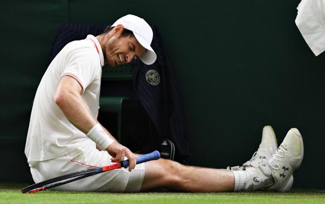 Andy Murray of Great Britain reacts after slipping over in his Men's Singles Second Round - GETTY IMAGES