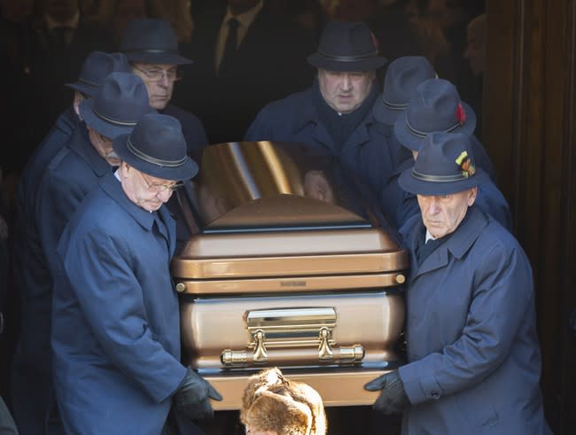 Pallbearers carry the coffin of reputed mafia boss Vito Rizzuto from a church in Montreal, Monday, Dec. 30, 2013, following his funeral. Rizzuto died last week from natural causes.THE CANADIAN PRESS/Graham Hughes