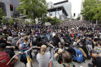 Peaceful protesters fill the intersection in front of Seattle City Hall Wednesday, June 3, 2020, in Seattle, following protests over the death of George Floyd, a black man who was in police custody in Minneapolis. (AP Photo/Elaine Thompson)