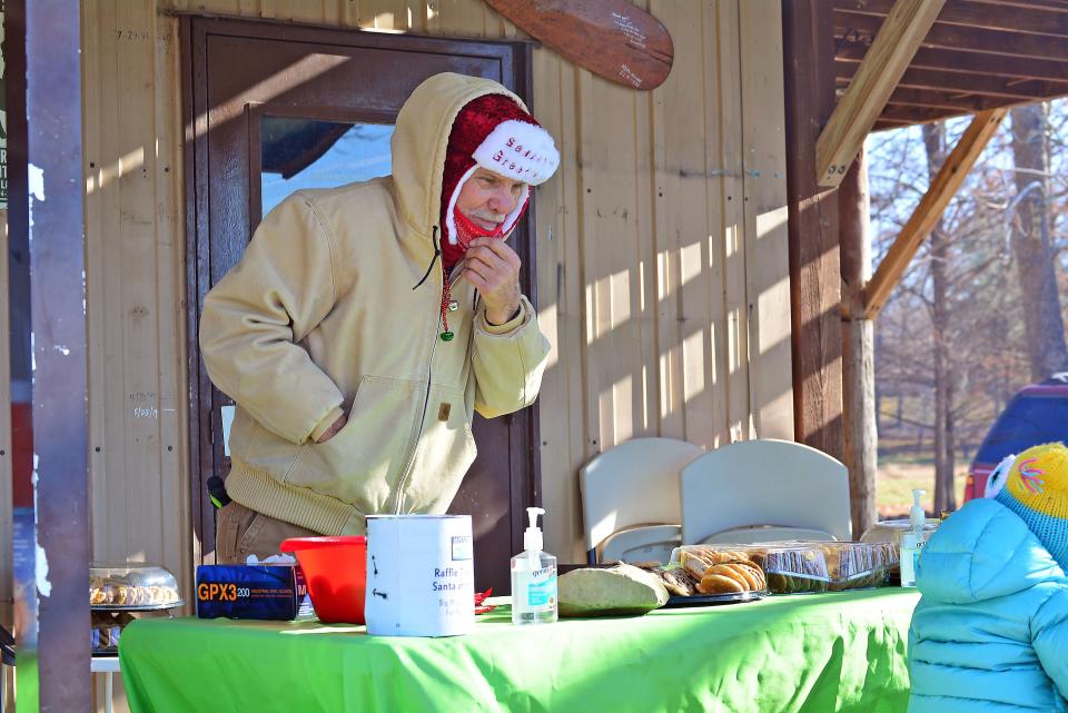 John Brady, fleet manager for Missouri River Relief, chats with guests at the Santa at the River event Saturday organized by Eileen and Barney Combs. The fundraiser was a peer-to-peer fundraiser for Missouri River Relief as part of the CoMoGives campaign.