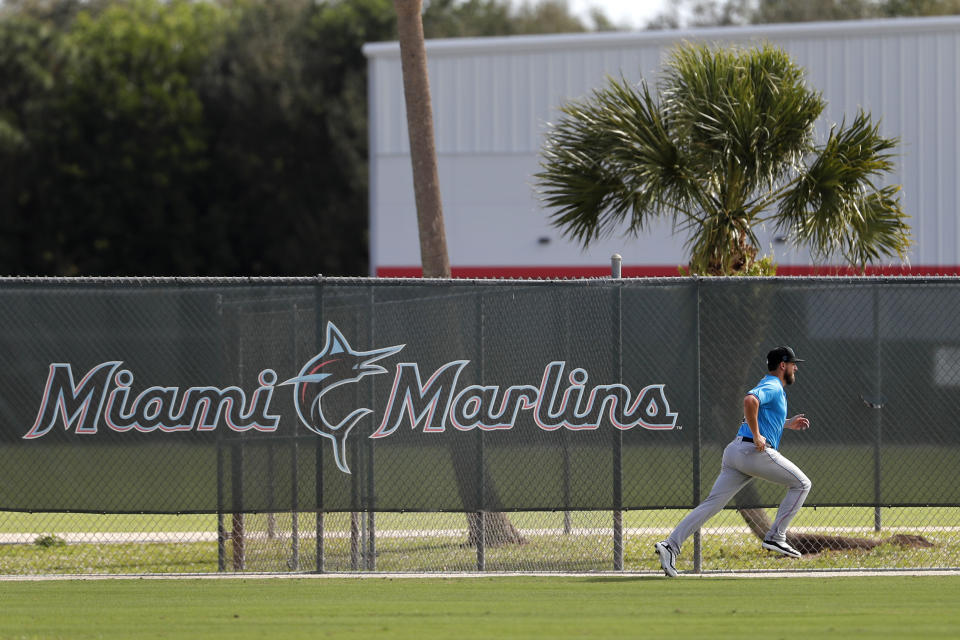 Miami Marlins pitcher Caleb Smith runs sprits during spring training baseball practice Sunday, Feb. 16, 2020, in Jupiter, Fla. (AP Photo/Jeff Roberson)