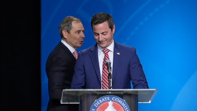 U.S. Rep. John Curtis, left, reacts to a statement made by Trent Staggs, right, following the Utah Senate primary debate for Republican contenders battling to win the seat of retiring U.S. Sen. Mitt Romney Monday, June 10, 2024, in Salt Lake City.