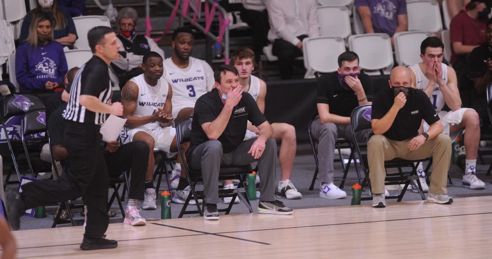 Brette Tanner, near right, and Joe Golding watch as their Abilene Christian men's basketball team plays Sam Houston State in a Southland Conference game Feb. 24, 2021 at the Teague Center. ACU won 86-72.