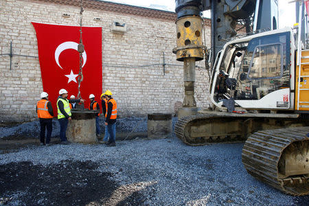 Workers attend a groundbreaking ceremony of Taksim mosque in Istanbul, Turkey, February 17, 2017. REUTERS/Osman Orsal