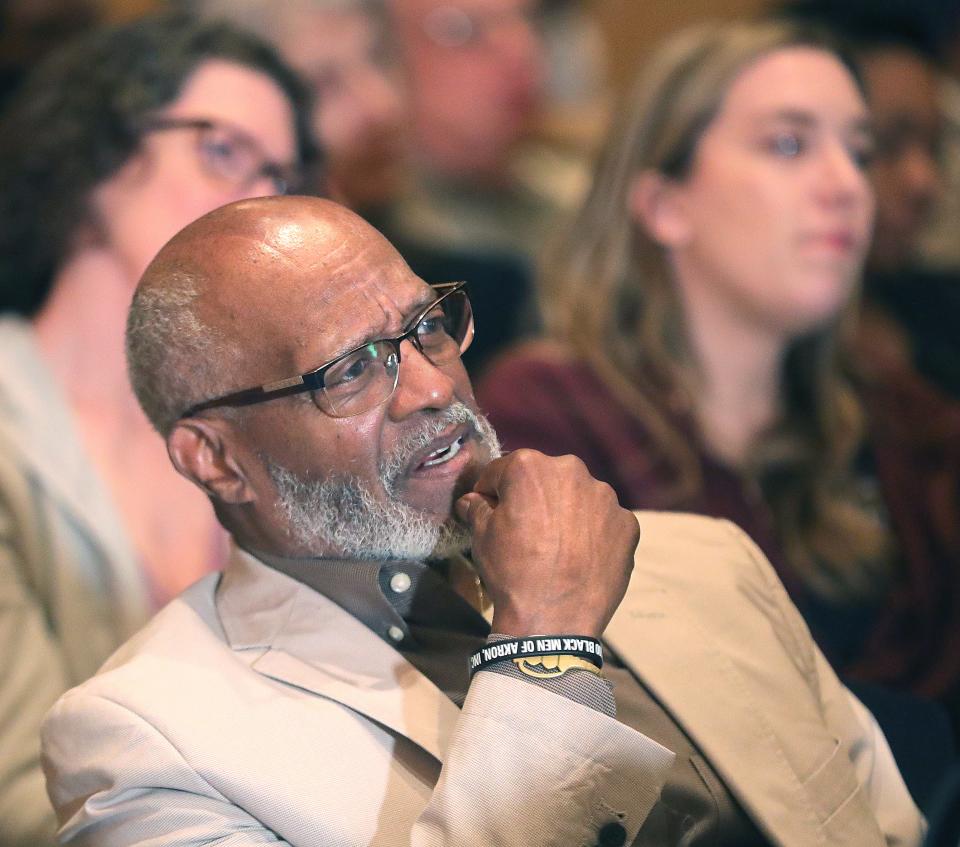 Michael Irby, president of 100 Black Men of Akron Inc., listens as Akron mayoral candidates answer how they will help the youth of the city during a televised debate at the Akron Summit Public Main Library auditorium on Wednesday.