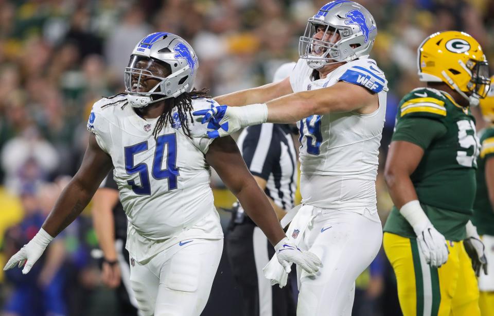 Detroit Lions defensive tackle <a class="link " href="https://sports.yahoo.com/nfl/players/33460" data-i13n="sec:content-canvas;subsec:anchor_text;elm:context_link" data-ylk="slk:Alim McNeill;sec:content-canvas;subsec:anchor_text;elm:context_link;itc:0">Alim McNeill</a> (54) celebrates with defensive end <a class="link " href="https://sports.yahoo.com/nfl/players/31967" data-i13n="sec:content-canvas;subsec:anchor_text;elm:context_link" data-ylk="slk:John Cominsky;sec:content-canvas;subsec:anchor_text;elm:context_link;itc:0">John Cominsky</a> (79) after sacking Green Bay Packers quarterback Jordan Love during their football game on Thursday, September 28, 2023, at Lambeau Field in Green Bay, Wis. Tork Mason/USA TODAY NETWORK-Wisconsin