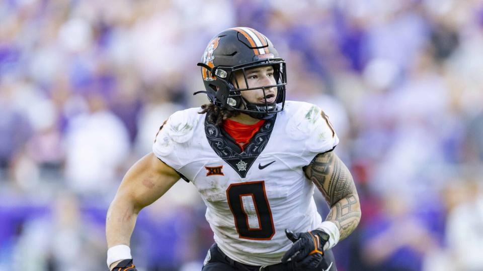 Mason Cobb scans the field while playing linebacker at Oklahoma State.