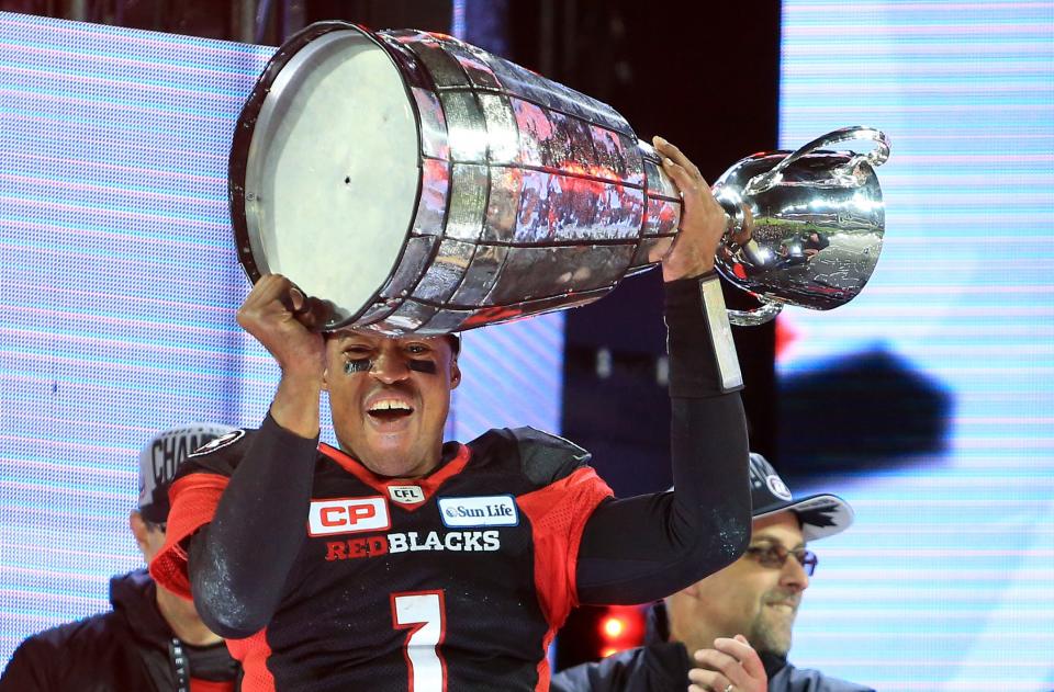 Quarterback Henry Burris #1 of the Ottawa Redblacks hoists the Grey Cup following the 104th Grey Cup Championship Game. (Photo by Vaughn Ridley/Getty Images)