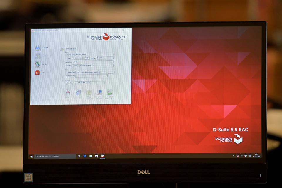 A monitor showing Dominion Voting Image Cast Central display tab is seen as Cobb County Election officials count ballots on a machine, Tuesday, Nov. 24, 2020, in Marietta, Georgia.