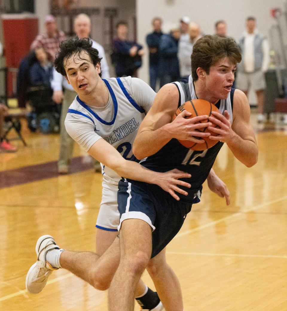 Mansquan Griffin Linstra drives past Holmdel’s Ben Kipnis in second half action. Manasquan Boys Basketball vs Holmdel in SCT Semifinals on February 14, 2024 in Red Bank. NJ.
