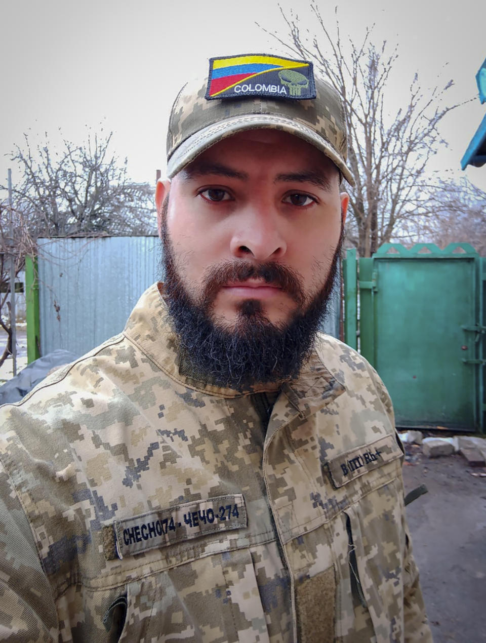 This 2023 photo provided by a 32-year-old professional soldier from Medellín, Colombia who goes by the call sign Checho shows him in his combat gear in Donbas, eastern Ukraine. Checho says he was struck by fire from a drone during a rescue operation to save a wounded colleague on the front line after three days of heavy fighting with Russian forces. At the hospital in the Kyiv region, Checho found himself with more than fifty other Colombians, most with light injuries sustained while fighting Russian forces in eastern Ukraine’s Donetsk region. They are among hundreds of Colombian veterans who have made the journey to Ukraine to help its forces fight the Russians. (Courtesy of Checho via AP)