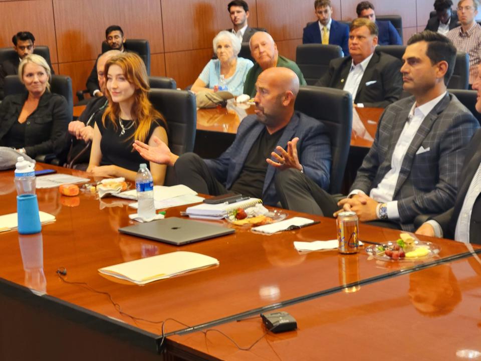 David Chessler, center, of Chessler Holdings, a Sarasota investment group, began the HUSTLE program at University of South Florida, in Tampa.