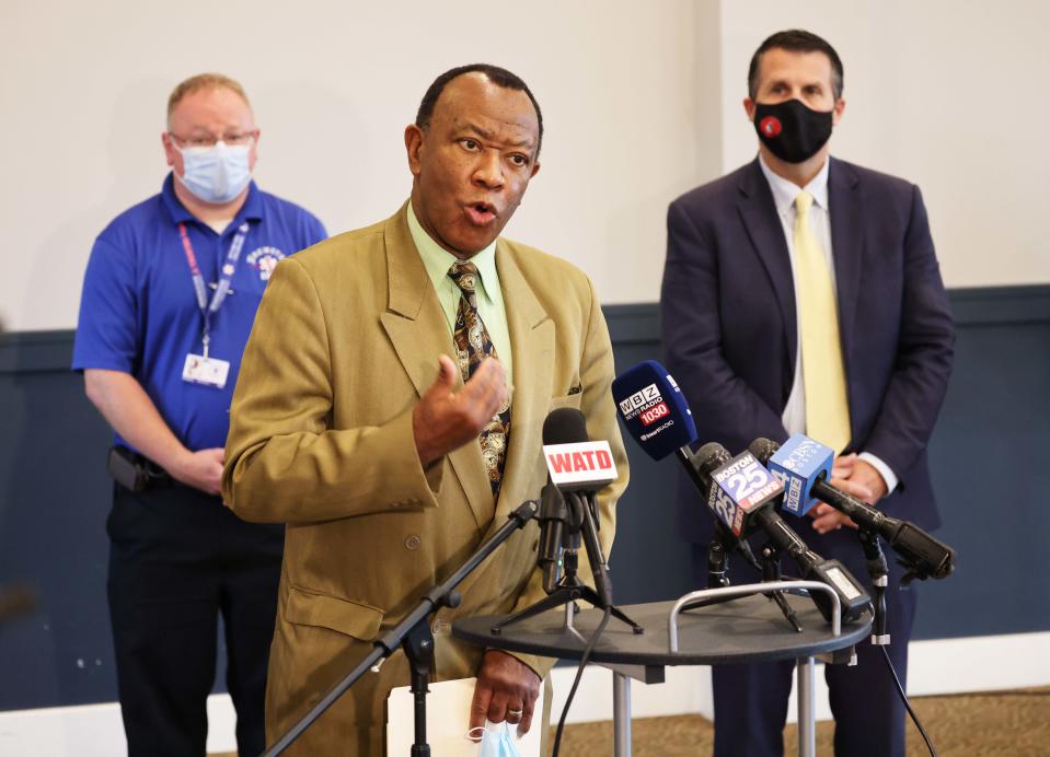 Board of Health Executive Health Officer Eno Mondesir, MD, center, Greg Davis, Brewster Director of Health, left, and Mayor Robert Sullivan, during a press conference at the Shaw's Center in Brockton for Covid-19 booster vaccines on Tuesday, Oct. 26, 2021.  