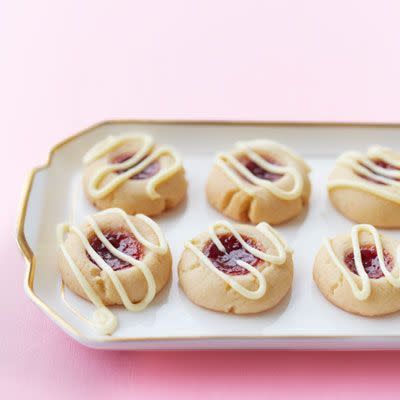 <p>These buttery thumbprint cookies perfectly complement the tartness of the raspberry-lemon filling, all topped off with a white chocolate drizzle that makes sure these aren't too sour. </p><p><em><a href="https://www.womansday.com/food-recipes/food-drinks/recipes/a39472/raspberry-lemon-thumbprint-cookies-recipe-ghk0513/" rel="nofollow noopener" target="_blank" data-ylk="slk:Get the Raspberry-Lemon Thumbprint Cookies recipe.;elm:context_link;itc:0;sec:content-canvas" class="link ">Get the Raspberry-Lemon Thumbprint Cookies recipe.</a></em></p>