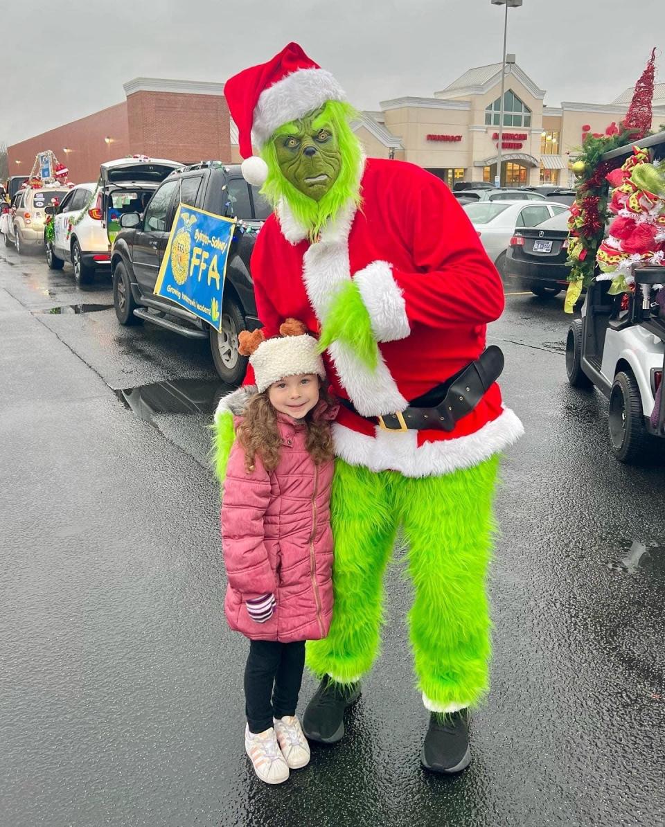 Haley Waliga doesn’t seem to mind giving the Grinch a hug in the snapshot from the Karns Fair Facebook page at the 2022 Karns Christmas Parade Saturday, Dec. 3, 2022.