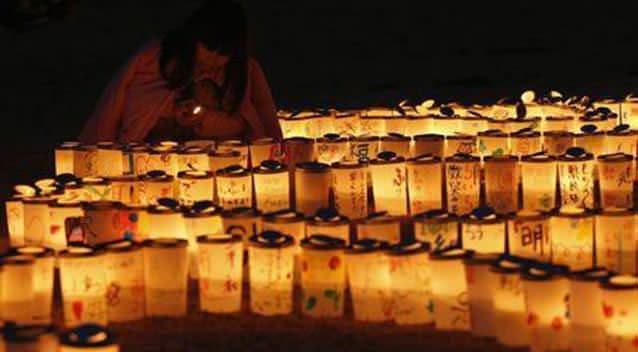 A candlelight memorial held in remembrance of victims of the earthquake and tsunami. Picture: Reuters