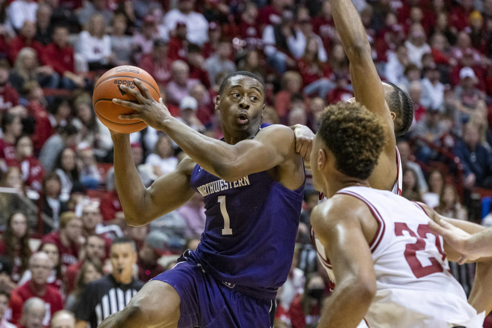 Northwestern guard Chase Audige (1) attempts to make a pass during the first half an NCAA college basketball game against Indiana, Sunday, Jan. 8, 2023, in Bloomington, Ind. (AP Photo/Doug McSchooler)