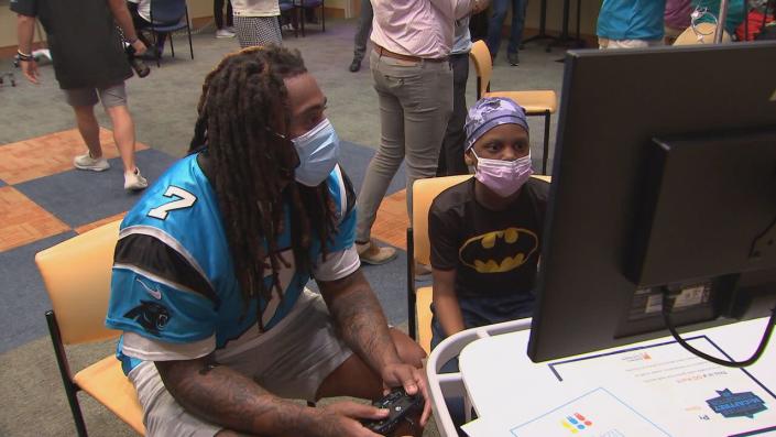 Carolina Panthers Shaq Thompson plays video games with patients at Levine Children's Hospital.