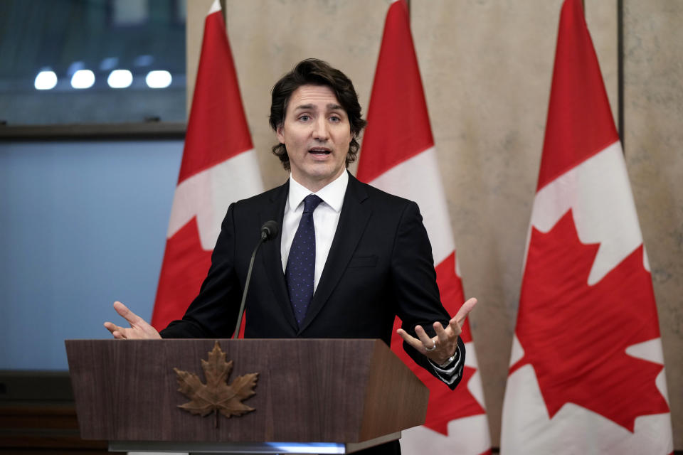 FILE - Canadian Prime Minister Justin Trudeau speaks during a media availability about the ongoing protests in Ottawa, Ontario, and blockades at various Canada-U.S. borders, in West Block on Parliament Hill, in Ottawa, Ontario, on Friday, Feb. 11, 2022. A public commission announced Friday, Feb. 17, 2023, that Trudeau’s government met the “very high threshold” for invoking the Emergencies Act to quell the protests by truckers and others angry over Canada’s COVID-19 restrictions last winter. (Justin Tang/The Canadian Press via AP, File)