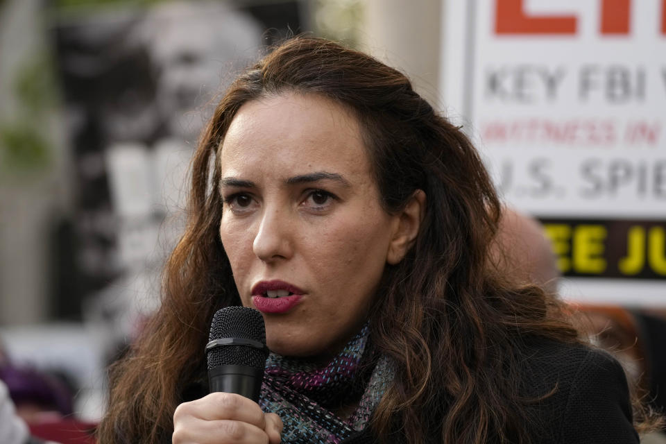 Julian Assange's partner, Stella Moris, addresses protestors outside the High Court in London, Wednesday, Oct. 27, 2021. The U.S. government is scheduled to ask Britain's High Court to overturn a judge's decision that WikiLeaks founder Julian Assange should not be sent to the United States to face espionage charges. A lower court judge refused extradition in January on health grounds, saying Assange was likely to kill himself if held under harsh U.S. prison conditions. (AP Photo/Frank Augstein)