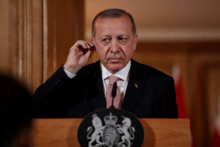 Turkey's President Recep Tayyip Erdogan, listens during a news conference with British Prime Minister Theresa May after their meeting at 10 Downing Street in London, Britain, May 15, 2018.  Matt Dunham/Pool via REUTERS