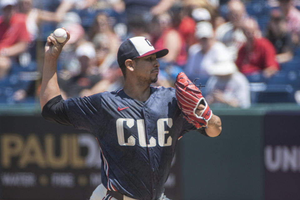 Cleveland Guardians starting pitcher Carlos Carrasco delivers against the San Francisco Giants during the first inning of a baseball game in Cleveland, Sunday, July 7, 2024. (AP Photo/Phil Long)