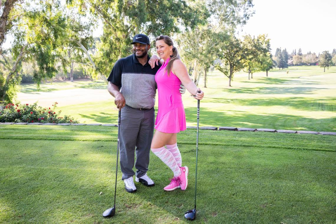 NFL Hall of Fame member Jerome Bettis stands for a photo with Heather Manfredda, a former World Long Drive champion, during the Phil Oates Celebrity Golf Classic at North Ridge Country Club in Fair Oaks on Monday.