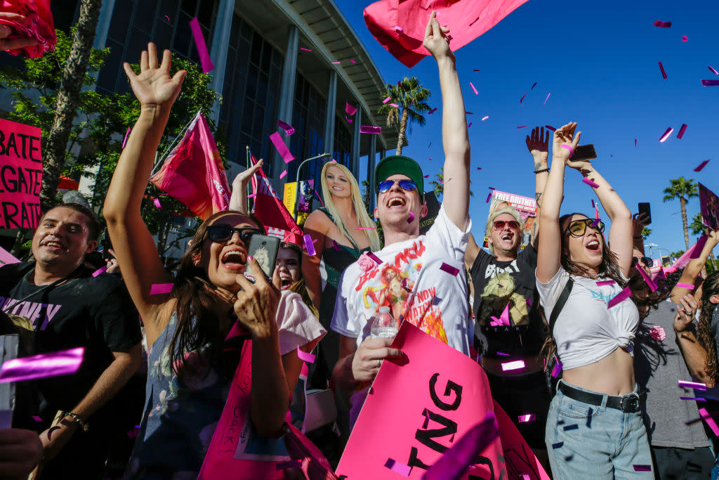 Supporters of the #FreeBritney movement celebrate, after a Los Angeles judge formally ends the conservatorship that had controlled Britney Spears's life for nearly
14 years, on Nov. 12 outside a Los Angeles courthouse. (Photo: Irfan Khan/Los Angeles Times)