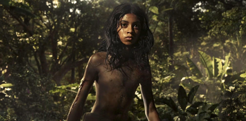 This image released by Netflix shows Rohan Chand as Mowgli in a scene from the film, "Mowgli: Legend of the Jungle," streaming on Netflix on Friday. (Netflix via AP)