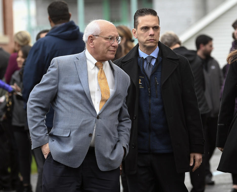 New York Rep. Paul Tonko, D-N.Y., left, and New York Assemblyman Angelo Santabarbara, D-Rotterdam, attend a funeral mass for eight of the 20 people killed in last Saturday's fatal limousine crash in Schoharie, N.Y., during a memorial service at St. Stanislaus Roman Catholic Church in Amsterdam, N.Y., Saturday, Oct. 13, 2018. (AP Photo/Hans Pennink)