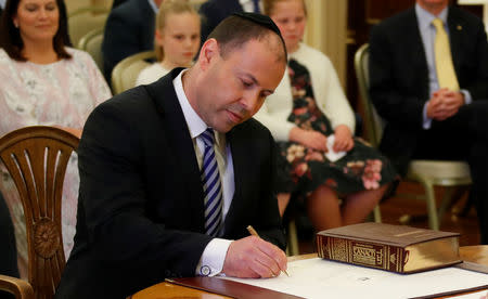 The new Treasurer Josh Frydenberg attends the swearing-in ceremony in Canberra, Australia August 24, 2018. REUTERS/David Gray/Files