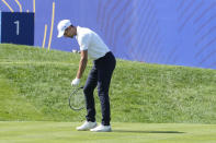 World number 1 tennis player Novak Djokovic pretends to use a tennis racket before he plays off the 1st tee during an all stars golf match between Team Colin Montgomerie and Team Cory Pavin at the Marco Simone Golf Club in Guidonia Montecelio, Italy, Wednesday, Sept. 27, 2023. The Ryder Cup starts Sept. 29, at the Marco Simone Golf Club. (AP Photo/Andrew Medichini)