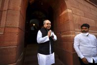 Indian Agriculture Minister Narendra Singh Tomar gestures as he arrives to attend the opening day of the winter session of Parliament in New Delhi, India, Monday, Nov.29, 2021. India’s parliament has repealed a set of controversial agriculture laws that inflamed tens of thousands of farmers, whose year-long protest has posed one of the biggest challenges to Prime Minister Narendra Modi’s administration. (AP Photo/Manish Swarup)