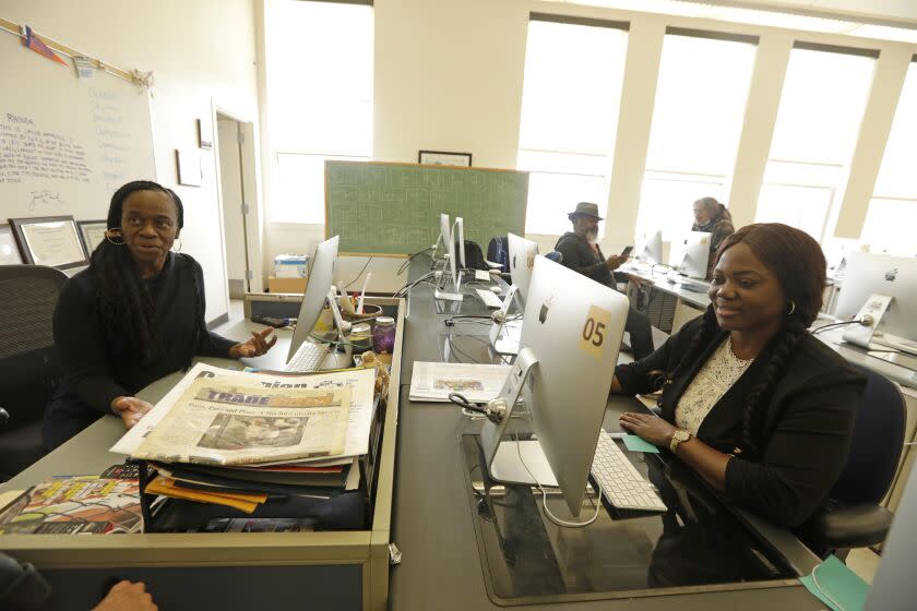 LOS ANGELES, CA - MAY 5, 2023 - Journalism professor Rhonda Guess, left, oversees the journalism class at Los Angeles City College (LACC) as student journalist Poupy Gaelle Nguetsop participates in a journalism class on May 5, 2023. Nguetsop and other student journalists in the class have been repeatedly barred by school administrators from covering sports and music events on campus in the past year. (Genaro Molina / Los Angeles Times)