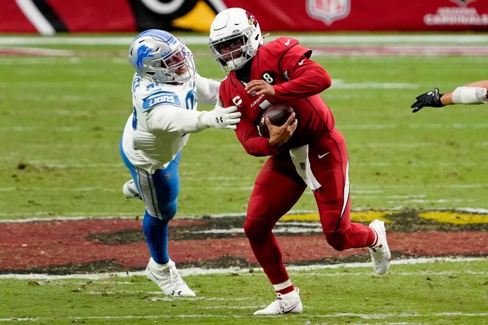 Cardinals quarterback Kyler Murray, right, escapes the reach of Lions defensive end Romeo Okwara during the second half on Sunday, Sept. 27, 2020, in Glendale, Ariz.