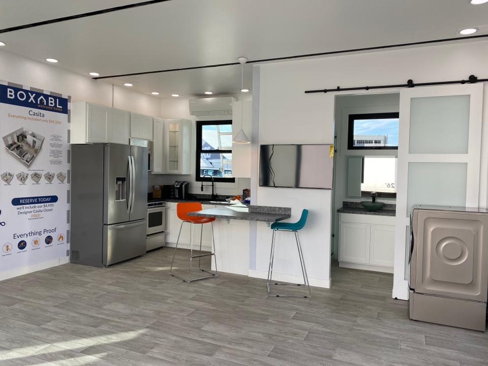 the kitchen and bathroom inside an example Casita