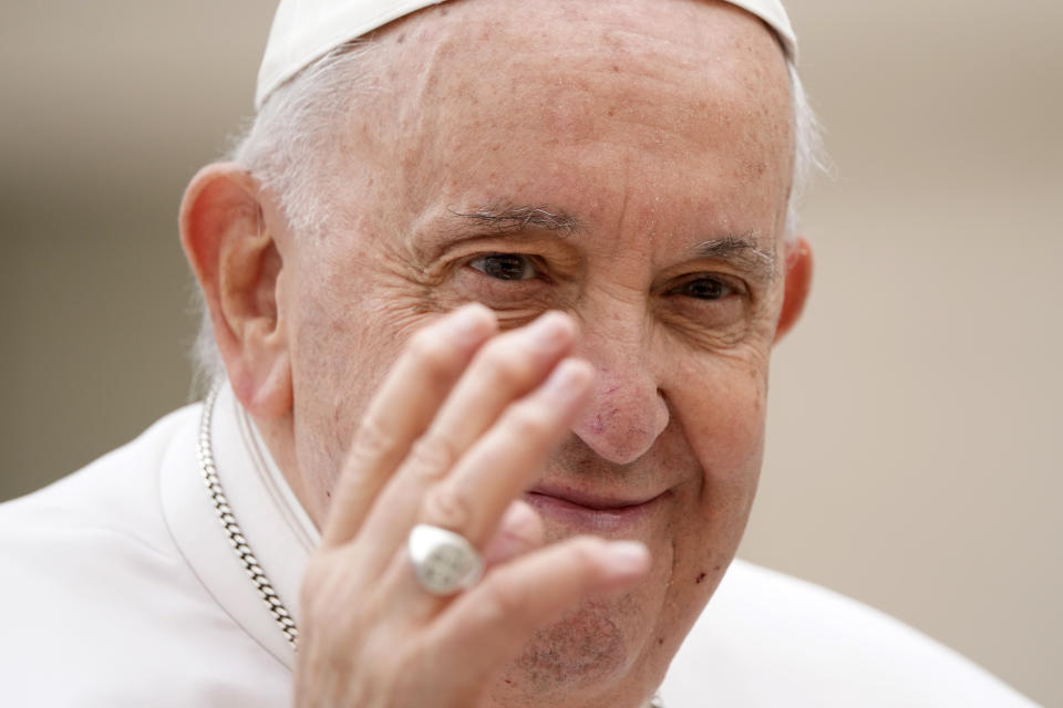 Pope Francis waves to faithful at the end of his weekly general audience in St. Peter's Square at The Vatican, Wednesday, March 8, 2023. (AP Photo/Andrew Medichini)