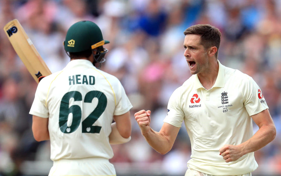 England's Chris Woakes (right) celebrates taking the wicket of Australia's Travis Head during day one of the Ashes Test match at Edgbaston, Birmingham. (Photo by Mike Egerton/PA Images via Getty Images)